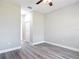 Inviting bedroom with wood-look flooring, neutral walls, and ample space at 2531 Sw 167Th Loop, Ocala, FL 34473
