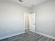 Clean and bright bedroom showcasing wood-look flooring and a neutral color scheme at 2531 Sw 167Th Loop, Ocala, FL 34473
