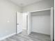 Bright bedroom featuring wood-look floors and large closet at 2531 Sw 167Th Loop, Ocala, FL 34473