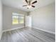 Well lit bedroom featuring a ceiling fan and window with natural light at 2531 Sw 167Th Loop, Ocala, FL 34473