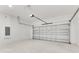 Spacious two-car garage featuring a white door, block walls, and ample room for storage at 2531 Sw 167Th Loop, Ocala, FL 34473