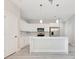 Modern kitchen featuring white cabinets, stainless steel appliances, and a center island at 2531 Sw 167Th Loop, Ocala, FL 34473