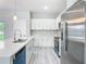 Well-equipped kitchen featuring stainless steel appliances, a center island and modern finishes at 2531 Sw 167Th Loop, Ocala, FL 34473