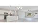 Open layout connecting the kitchen with stainless steel appliances to the living area at 2531 Sw 167Th Loop, Ocala, FL 34473