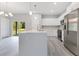 Modern kitchen with an island, stainless steel appliances, and pendant lighting at 2531 Sw 167Th Loop, Ocala, FL 34473