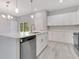 Stylish kitchen with stainless steel appliances, quartz counters, and modern cabinetry at 2531 Sw 167Th Loop, Ocala, FL 34473
