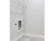 Laundry room with hookups for washer and dryer and overhead storage at 2531 Sw 167Th Loop, Ocala, FL 34473