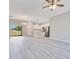Open-concept living space with an island kitchen and stainless steel appliances at 2531 Sw 167Th Loop, Ocala, FL 34473