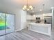 Inviting open floor plan integrating kitchen and living room with stainless appliances and natural light at 2531 Sw 167Th Loop, Ocala, FL 34473