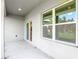 Covered porch featuring a window and a sliding glass door with access to the interior at 2531 Sw 167Th Loop, Ocala, FL 34473