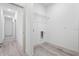 Clean laundry room with vinyl flooring, wire shelving, and washer/dryer hookups at 2593 Sw 153Rd Ln, Ocala, FL 34473