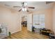 A bedroom showing wood laminate flooring and an open doorway to the rest of the home at 26609 Bull Run, Leesburg, FL 34748