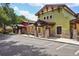 Colorful village exterior with a charming atmosphere, outdoor seating, and convenient parking at 26609 Bull Run, Leesburg, FL 34748