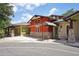 Exterior view of the Village Green featuring colorful facades, stone accents, and the Chesapeake Bay Grille at 26609 Bull Run, Leesburg, FL 34748