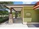 Community building exterior featuring signage and access to amenities and dining at 26609 Bull Run, Leesburg, FL 34748