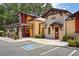 Charming exterior view showcasing the colorful buildings with stone accents and inviting entranceways at 26609 Bull Run, Leesburg, FL 34748