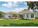 Charming single-story home featuring a well-manicured lawn, an inviting entrance, and a spacious two-car garage at 26609 Bull Run, Leesburg, FL 34748