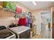 The laundry room is adjacent to the kitchen and includes appliances, wire shelving, and a utility sink at 26609 Bull Run, Leesburg, FL 34748