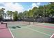 Multiple tennis courts, perfect for active lifestyles and community tournaments surrounded by greenery at 26609 Bull Run, Leesburg, FL 34748