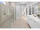 Spa-like bathroom featuring a glass-enclosed shower, double vanity, and modern fixtures at 2681 Ginseng Ivy St, Apopka, FL 32703