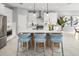 Elegant kitchen boasts a large island, sleek countertops, and ample white cabinetry at 2681 Ginseng Ivy St, Apopka, FL 32703