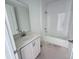 Bathroom with a modern vanity and a shower over tub at 30112 Misty Pines Rd, Mount Dora, FL 32757