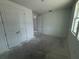 This is a bedroom featuring a double closet with doors, a window and a doorway at 30112 Misty Pines Rd, Mount Dora, FL 32757