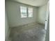 Bright bedroom featuring natural light from two large windows and a doorway at 30112 Misty Pines Rd, Mount Dora, FL 32757