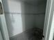 Spacious walk-in closet with wire shelving, concrete floor and white walls, ready for organizing clothes and accessories at 30112 Misty Pines Rd, Mount Dora, FL 32757
