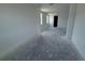 Open-concept living room featuring two windows and an entrance at 30112 Misty Pines Rd, Mount Dora, FL 32757