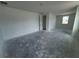 A big living room featuring a window and a doorway at 30112 Misty Pines Rd, Mount Dora, FL 32757