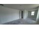 A wide view of a living room featuring a window and doorway at 30112 Misty Pines Rd, Mount Dora, FL 32757