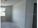 Minimalist living room featuring a bright window and modern lighting at 30112 Misty Pines Rd, Mount Dora, FL 32757