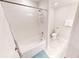 Bathroom featuring a shower-tub combo, white tiled walls, and a toilet at 3150 Paradox Cir # 102, Kissimmee, FL 34746