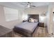 Comfortable bedroom featuring a plush bed, neutral decor, and a ceiling fan for added comfort at 3150 Paradox Cir # 102, Kissimmee, FL 34746