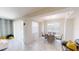 Bright dining area with a modern chandelier and access to a balcony with sliding glass doors at 3150 Paradox Cir # 102, Kissimmee, FL 34746