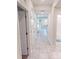 Hallway featuring neutral paint and tile flooring, connecting various rooms in the home at 3150 Paradox Cir # 102, Kissimmee, FL 34746