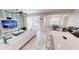 Inviting living room featuring a comfy sofa, TV, and sliding glass doors for indoor-outdoor living at 3150 Paradox Cir # 102, Kissimmee, FL 34746