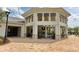 Modern outdoor bar area with seating and a covered structure, perfect for entertaining guests in the community at 3150 Paradox Cir # 102, Kissimmee, FL 34746