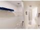 Walk-in closet, next to the shower with a towel rack, for the main bedroom, with shelving for organization at 3150 Paradox Cir # 102, Kissimmee, FL 34746
