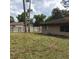 View of the backyard featuring the brick exterior of the home at 3152 Clewiston St, Deltona, FL 32738