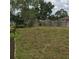 Large backyard area enclosed with a wooden fence at 3152 Clewiston St, Deltona, FL 32738