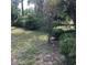 View of the backyard with various trees and bushes at 3152 Clewiston St, Deltona, FL 32738