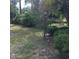 View of the backyard with various trees and bushes at 3152 Clewiston St, Deltona, FL 32738