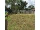 Spacious backyard framed by a wooden fence, offering privacy at 3152 Clewiston St, Deltona, FL 32738