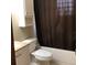 A full bathroom with a shower/tub combo, toilet and vanity at 3152 Clewiston St, Deltona, FL 32738
