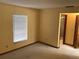 Bright bedroom featuring carpet floors, window with blinds, and neutral-toned walls, creating a calming and inviting atmosphere at 3152 Clewiston St, Deltona, FL 32738