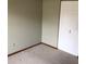 Neutral bedroom showing wall to wall carpet and a double door closet at 3152 Clewiston St, Deltona, FL 32738