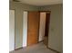 Bedroom features a door to another room, wall-to-wall carpet and a closet at 3152 Clewiston St, Deltona, FL 32738