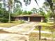 Well-maintained single-story brick home with a two-car garage and a long driveway at 3152 Clewiston St, Deltona, FL 32738